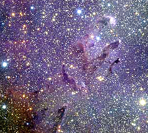 Dust clouds in the Eagle Nebula, including several prominent pillars, set against of backdrop of stars and galaxies at various distances from Earth.